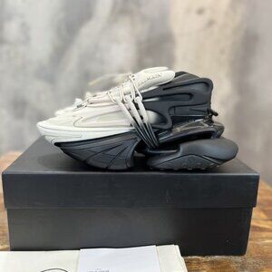 Balmain Unicorn Series Sneakers In A Black And White Gradient Color Scheme.